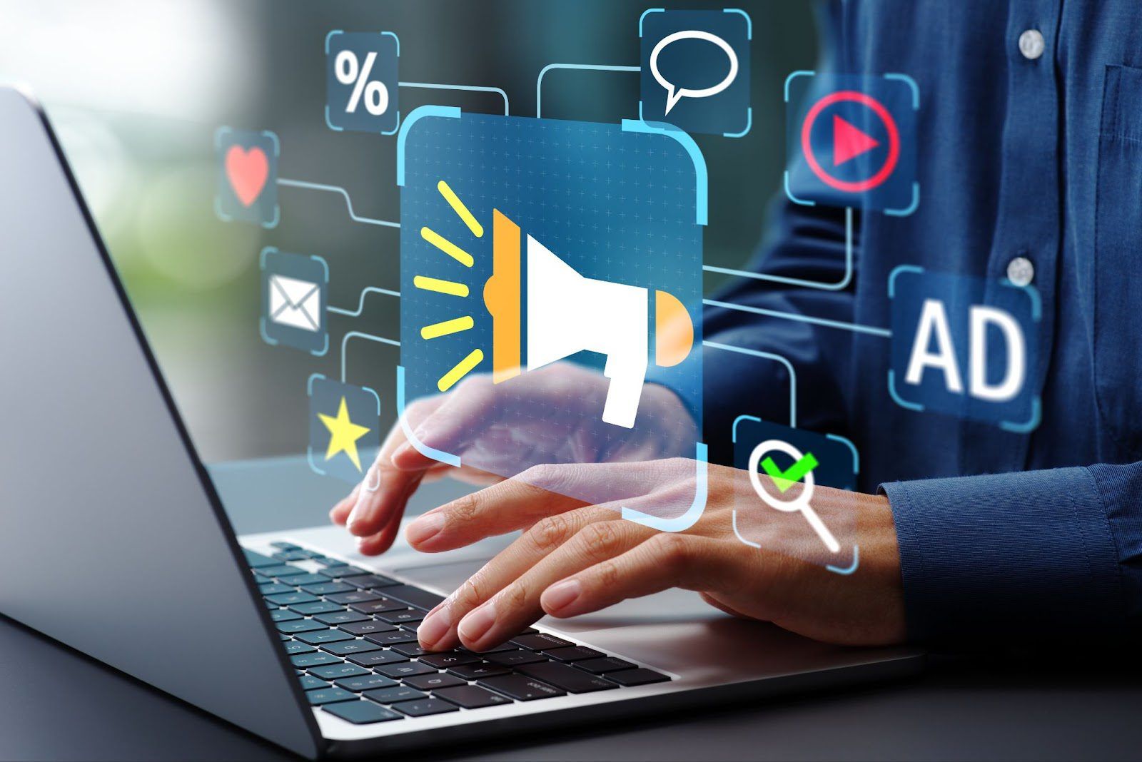 A person using a laptop with holographic icons, including a megaphone, heart, and AD symbols, representing digital marketing or advertising.