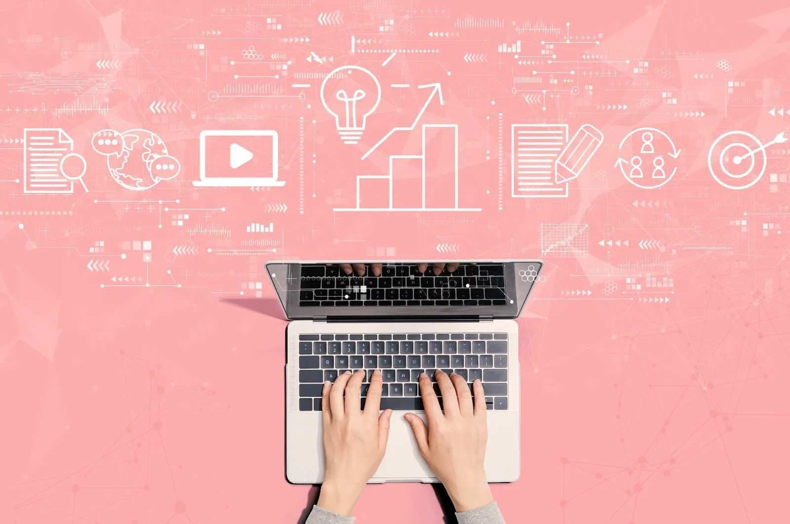 Hands typing on a laptop with digital icons representing ideas, growth, and connectivity on a pink background.